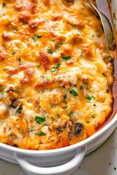 a casserole dish with chicken and cheese