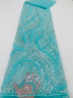 This high quality Fabric is measured in 5 Yards With Embroidered Beading and Sequin. It is soft, very delicate and beautiful. This high Quality Fabric is made with Fashion embroidered rhinestones can be used in making party wedding dresses, skirts, shawls, scarves and other other fashion apparels as you would like. Size : Length : 5 yards (180 inch). Width: 50 inch (Please allow slight deviation for the measurement data ,±1 inch) Material: 100% Polyester, Tulle Lace Fabric, Eco-Friendly embroide Blue Embroidered Wedding Fabric With Rhinestones, Elegant Green Sequin Fabric With Rhinestones, Tulle Lace, Wedding Party Dresses, Lace Fabric, Quality Fabric, Shawl, Wedding Party, Wedding Dresses