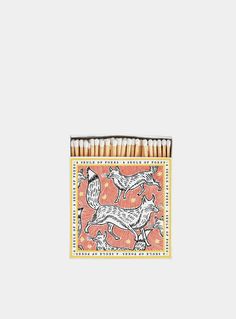 matches are stacked on top of each other with an image of two dogs in the middle