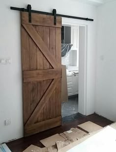 an open sliding barn door in the corner of a room