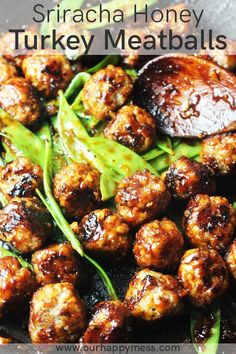 some meatballs and vegetables are cooking in a skillet