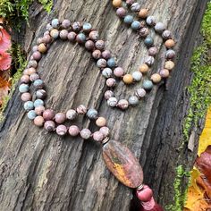 This mala is made with high-quality Sonora and Red Creek Jasper gemstones which bring connection and tranquility to the wearer. Zodiac Signs: Aries and Scorpio Chakras: Root and Sacral Sonora Jasper is a very grounding stone and connects you to the Earth's energy, and is known as the “supreme nurturer.” It sustains and supports during times of stress, bringing a sense of tranquility and wholeness. This stone unifies all aspects of your life. Jasper helps to calm the mind and works in the emotion Spiritual Multicolor Jasper Necklaces, Multicolor Jasper Spiritual Necklace, Nature-inspired Gemstone Beads Jewelry For Meditation, Multicolor Gemstone Necklace For Meditation, Spiritual Stone Beaded Necklaces For Meditation, Spiritual Jasper Jewelry For Meditation, Spiritual Beaded Necklaces For Meditation, Nature-inspired Gemstone Beaded Necklace For Wellness, Nature-inspired Multicolor Gemstone Bead Necklaces