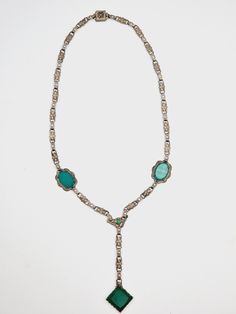 Antique Art Deco Chrydoprase Glass Silver Tone Necklace Circa 1930's. A lovely Art Deco necklace featuring chrysoprase glass stones set with embossed silver tone metal links. The necklace closes with a decorative secure box clasp. In really good condition. The length of the necklace is 44 cm and the pendant drop is 7.5 cm. Please study the pictures carefully as they do form part of the description. Please feel free to contact me with any questions. As will all vintage/antique jewellery items, pl Art Deco Necklace, Box Clasp, Antique Art Deco, Antique Jewellery, Antique Art, Stone Settings, Vintage Necklace, Vintage Antiques, Jewelry Necklace Pendant