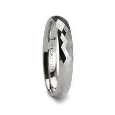 a white gold wedding ring with black diamond inlays on the outside and inside