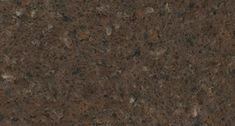 a close up view of a brown granite countertop with dark brown speckles