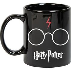 a harry potter mug with lightning bolt and glasses on the inside is shown in black