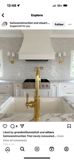 a kitchen with white marble counter tops and gold faucets on the sink area