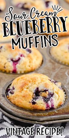 blueberry muffins in a muffin tin with text overlay that reads sour cream blueberry muffins vintage recipe