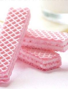 pink waffles are stacked on top of each other