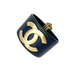 Chanel Navy Leather Brushed Gold Logo Cuff Bracelet 2017 For Sale at 1stDibs Luxury Gold Bangle Leather Bracelet, Gold Leather Cuff Bracelet, Elegant Formal Leather Cuff Bracelet, Modern Cuff Bracelet Bangle As Fashion Accessory, Designer Bangle Cuff Bracelet, Luxury Cuff Bracelet, Luxury Cuff Bracelets, Luxury Adjustable Cuff Leather Bracelet, Luxury Adjustable Leather Cuff Bracelet