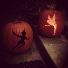 two pumpkins that have been carved to look like peter rabbit and tinkerbell