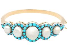 For Sale on 1stDibs - A stunning Victorian natural pearl and turquoise, 14k yellow gold and silver set bangle; part of our diverse antique jewelry and estate jewelry collections. Fine Jewelry Bracelet With Cabochon, Luxury Cabochon Bracelets For Wedding, Luxury Wedding Bracelet With Cabochon, Elegant Turquoise Multi-stone Bracelets, Yellow Gold Cabochon Bracelets For Weddings, Antique Turquoise Bangle, Antique Cabochon Bracelets For Wedding, Elegant Turquoise Bangle For Wedding, Oval Cabochon Bracelet For Wedding