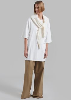 Color: White Midweight cotton jersey Oversized fit Crew neckline Drop shoulders Slip on style Unlined 100% Cotton Dry Clean Only By The Frankie Shop. Imported Off White Cotton Loungewear Tops, Relaxed White Cotton Top, Off White Cotton Tops For Loungewear, White Relaxed Tops For Fall, Relaxed White Tops For Fall, Oversized White Tops For Loungewear, Relaxed White Boxy Fit Top, Oversized White Cotton Tops, White Basic T-shirt For Layering