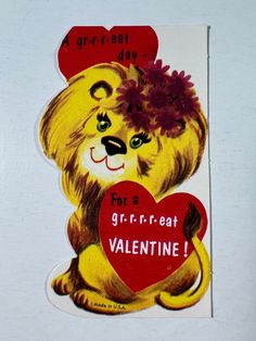 a sticker depicting a lion holding a heart with the words for a grrr - cat valentine written on it