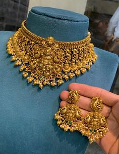 Traditional Indain chocker set, Kempu Choker set with matching earrings. Beautifully studded with ruby stones, Uncut stones and bunch of small pearls with green monnalisa beads hanggings. Temple Necklace set. Perfect choice for any Indian occasion(Marriages, Engagements, Functions, Festivals). This Necklace contains a  adjustable gold dori.  Earring Closure: Push back All International Shipments of our Jewelry is dispatched through either DHL or UPS and are delivered to your doorstep. Care: We d Indian Jewelry Sets Gold Antique, Luxury Traditional Temple Necklace For Navratri, Golden Choker Necklace Indian, Temple Jewelry Sets For Marriage And Festivals, Indian Gold Choker Necklace, Gold Chockers, Gold Choker Necklace Indian, Emerald Gold Necklace, Secret Rings