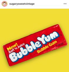 a bar of bubble gum sitting on top of a yellow background with the caption bubble gum