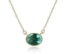 Introducing a captivating solitaire emerald necklace, adorned with a breathtaking 1.30-carat oval cut emerald. Set horizontally in a thin bezel setting, the emerald showcases a medium green color, with semi-transparent clarity and a delightful play of luster. Crafted in luxurious 14k gold, the necklace features a dainty cable chain that can be effortlessly adjusted from 18 to 16 inches in length, ensuring a perfect fit and adding a touch of versatility to this elegant piece. Setting Style: Bezel May Emerald, Emerald Set, Emerald Style, Halo Necklace, Solitaire Necklaces, Emerald Necklace, Modern Necklaces, Emerald Earrings, Solitaire Pendant