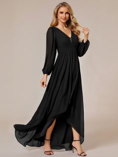 a woman wearing a long black dress