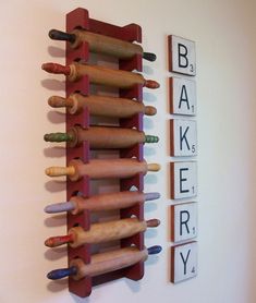 a rack with rolling dough on it next to scrabble letters