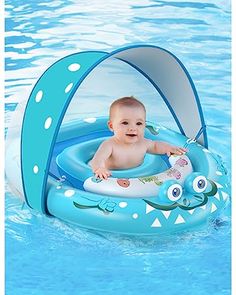 a baby sitting in an inflatable boat floating on top of the pool water