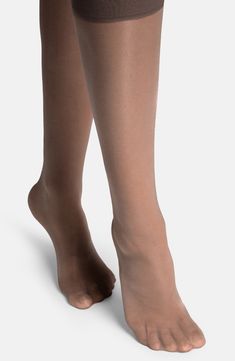 These knee-highs are delightfully translucent and easy to keep in place all day long with a wide cuff that won't dig in. Polyamide/elastane Machine wash, line dry Imported Nylon Knee-high Socks, Sheer Stretch Knee-high Legwear, Fitted Mid-calf Stockings, Elegant Stretch Mid-calf Legwear, Classic Stretch Knee-high Legwear, Micro-elastic Solid Mid-calf Hosiery, Solid Mid-calf Stretch Hosiery, Mid-calf Solid Color Stretch Hosiery, Sheer Fitted Nylon Socks