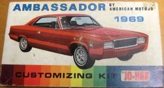 an old red car is on display in the box that says ambassador by american motors