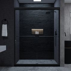 a black and white bathroom with a glass shower door