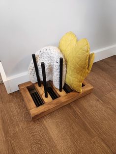 This glove or hat storage rack is the perfect way to dry your winter clothes off after a day in the snow. It sits over a floor vent and uses the heat from the house to dry off hats and gloves or mittens. There are six pegs for three pairs of gloves or two pairs of gloves and two hats. If you would like more storage, you can choose to add two pegs on each side of the rack for a total of 10 spots. The overall size is 13.5" x 8.5" x 8.75". The pegs are removable for easy storage and they can be put Glove Dryer, Diy Mittens, Floor Vent, Heat Vents, Women's Mittens, Floor Vents, Hat Storage, Snow Outfit, Clothes Hooks