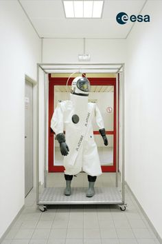 an astronaut suit on display in a hallway