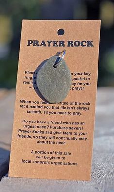 a card with a poem about prayer on it sitting on top of a wooden table