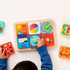 a child playing with toys on the floor