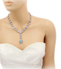 This bridal necklace and earrings set features exquisite Top quality 23mm Swarovski Light Turquoise Teardrop Crystal, brilliant Cubic zirconia, platinum plated components and rhinestones. and pear cut pendant 3 inches backdrop. Sparkling 23mm Swarovski Light Turquoise Teardrop Crystal and daisy rhinestones elegantly dangle from ear posts. The zirconia are set in rhodium plate surrounding rhinestones. This gorgeous jewelry set will look elegant and beautiful quality on any classic or vintage insp Blue Hand Set Bridal Necklace For Wedding, Elegant Turquoise Jewelry Sets For Wedding, Elegant Turquoise Wedding Jewelry Sets, Elegant Turquoise Bridal Necklace For Wedding, Hand Set Teardrop Bridal Necklace, Turquoise Jeweled Wedding Jewelry, Turquoise Wedding Jewelry With Jewels, Turquoise Teardrop Wedding Jewelry, Blue Wedding Necklace