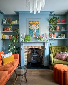 a living room with two couches and a fire place in the middle of it