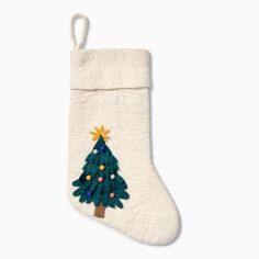 a stocking with a christmas tree on it