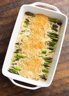 a casserole dish with asparagus and cheese