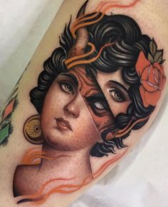 a woman's face with horns and flowers on her head is shown in this tattoo