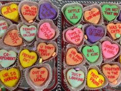 two trays filled with heart shaped cupcakes that say, i don't hate