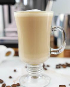 a cup of coffee sitting on top of a table