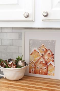 Cute gingerbread village free Christmas printable. #christmasprintable #gingerbreadartwork, #gingerbreadprintable #christmaskitchen #kitchendecor #christmaskitchendecor #gingerbread #gingerbreaddecor #Christmasdecor