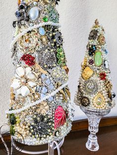 a christmas tree made out of old jewelry