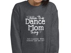 Killin' This Dance Mom Thing Sweatshirt KILLIN' THIS DANCE MOM THING. JUST KIDDING. WHAT NUMBER ARE WE ON? Sweatshirt * 50% cotton, 50% polyester * Pre-shrunk * Classic fit * Air-jet spun yarn with a soft feel * Double-needle stitched collar, shoulders, armholes, cuffs, and hem Dance Mom Gifts, Survival List, Dance Crop Tops, Dancer Shirt, Cricut Shirts, What What, Dance Stuff