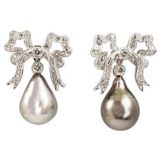 South Sea Pearl with Diamond 0.67 carat Earrings set in 18 Karat White Gold Settings Width: 1.8 cm Length: 2.6 cm Total Weight: 11.93 grams "We first opened doors in 1980 when it was then situated in the vicinity of the Victory Monument; a small and modest storefront with a couple of counters. From its humble beginnings to where it stands today, our company has proven its abilities as a jeweler. Since the beginning, we have been supplying fine quality pieces to dealers, wholesalers and customers Luxury White Gold Art Deco Earrings, Luxury Platinum Diamond Earrings Hallmarked, Luxury Hallmarked Pear-shaped Diamond Earrings, Formal White Gold Clip-on Diamond Earrings, White Gold Clip-on Diamond Earrings For Formal Events, Luxury Hallmarked Diamond Earrings For Formal Occasions, Luxury Diamond Pearl Earrings For Formal Events, Luxury Diamond Pearl Earrings For Formal Occasions, Luxury Pear-shaped Diamond Earrings For Evening