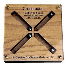 the cross roads sign is made out of wood