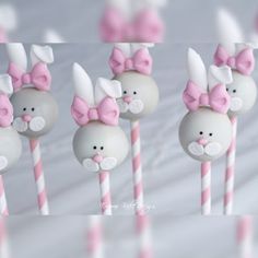 there are many bunny lollipops with pink bows on them