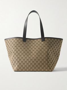 Gucci's tote is spacious, versatile and timeless, making it the perfect everyday style. Crafted in Italy from canvas-jacquard, it's woven with the house's iconic 'GG' monogram and has leather trims including a detachable zipped pouch for small essentials. Stow your laptop, water bottle and spare pair of flats inside. Gucci Canvas Shopping Bag, Bag Wishlist, Gucci Tote Bag, Flat Dress Shoes, Gg Monogram, Gucci Eyewear, Gucci Tote, Gucci Leather, Shopping Ideas