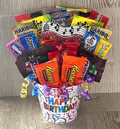 a birthday bucket filled with candy and candies