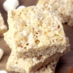 rice krispy treats stacked on top of each other with marshmallows around them