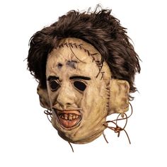 a creepy mask with hair on top of it