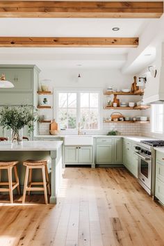 a kitchen with wooden floors and green cabinets