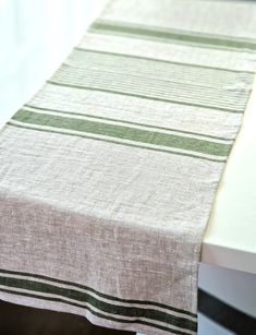 a table with a green and white striped cloth on it